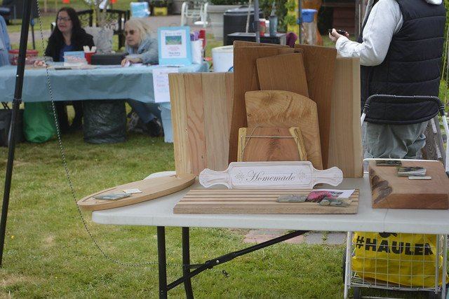 Handcrafted wooden boards displayed at a past festival