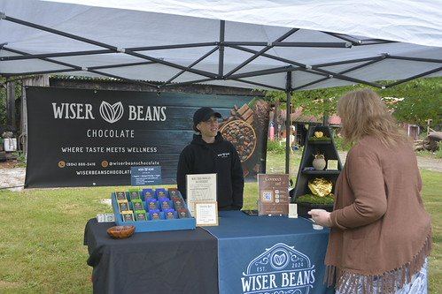 People at a past festival business booth